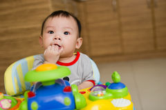 6-month-old-asian-baby-girl-chewing-fingers-19605657